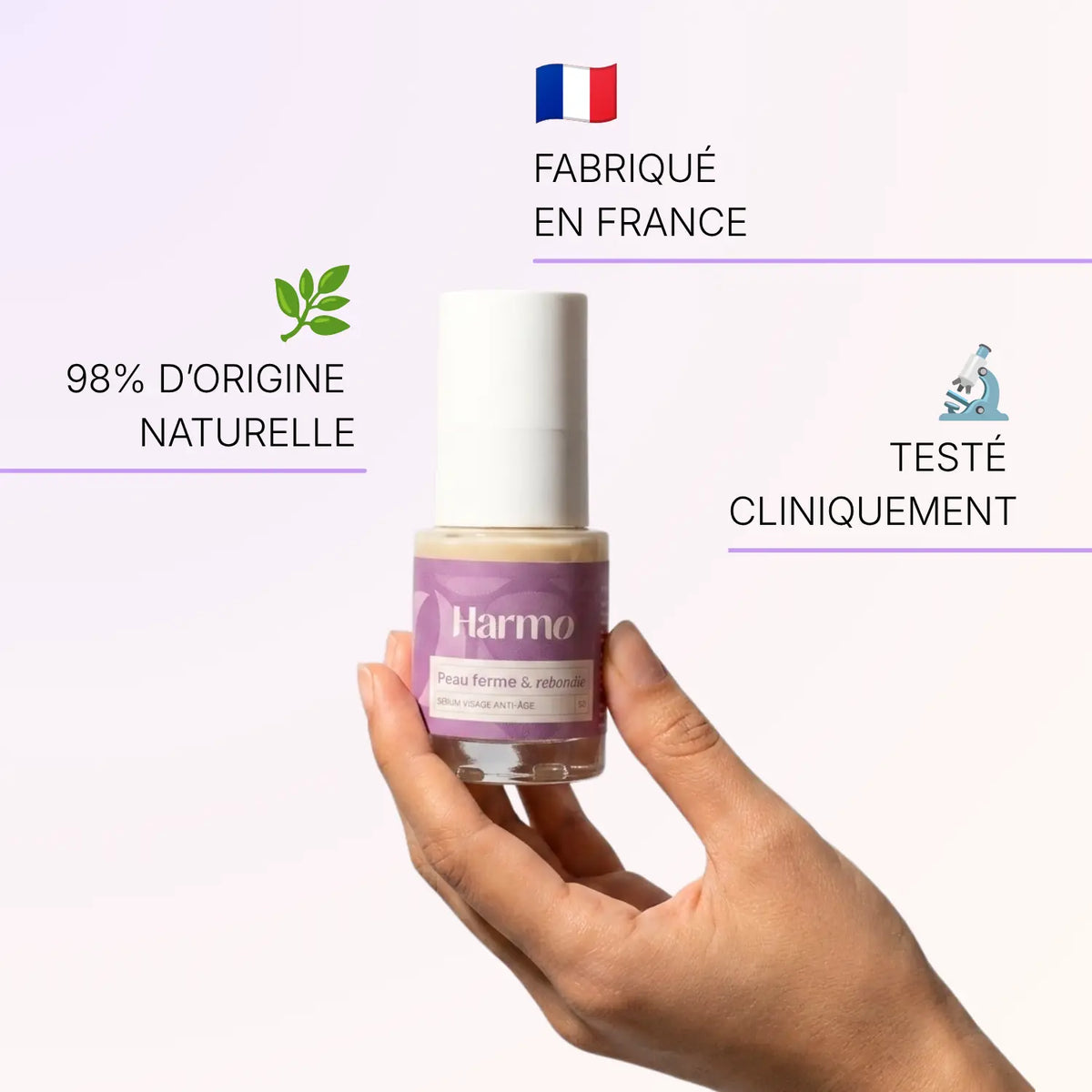Sérum anti-âge Harmo tenu à la main, fabriqué en France, d'origine naturelle et testé cliniquement